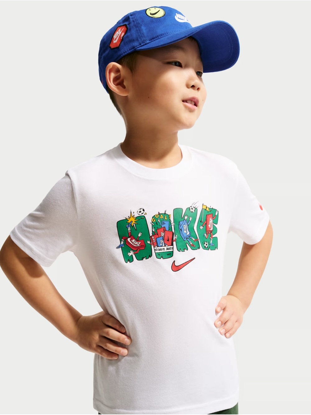 Nike White Kids' Graphic Tee with Green and Red Accents